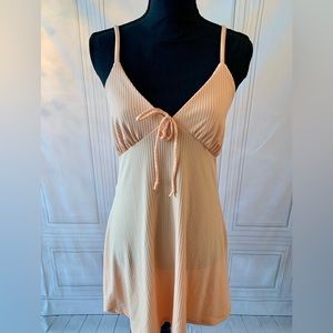 Peach dress with adjustable straps. Has never been worn